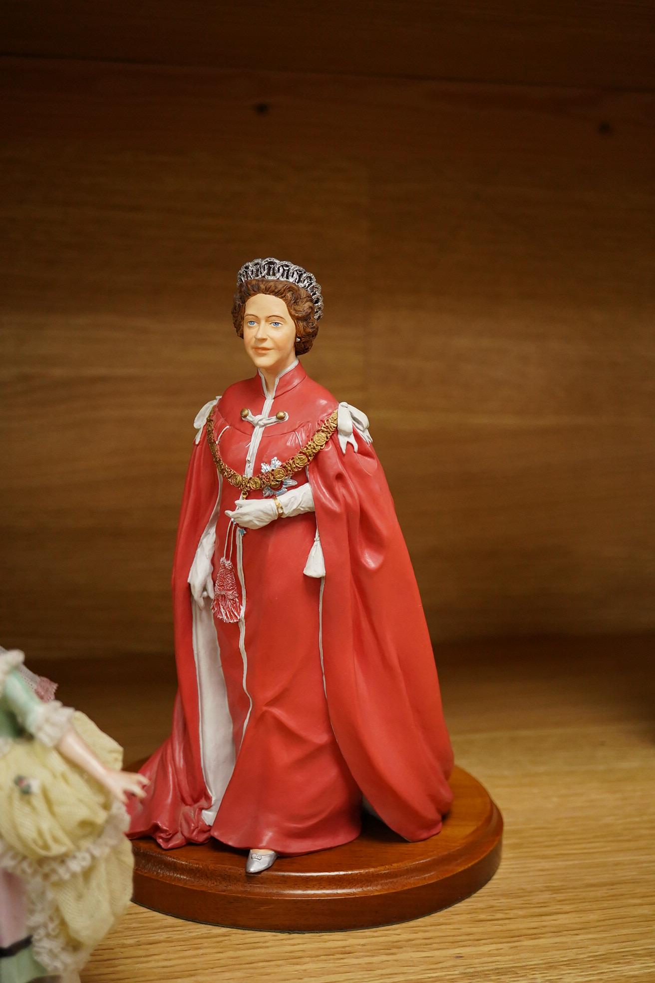 Nine continental figurines, to include Dresden porcelain lace examples, together with a resin figurine of Queen Elizabeth, largest 23cm high